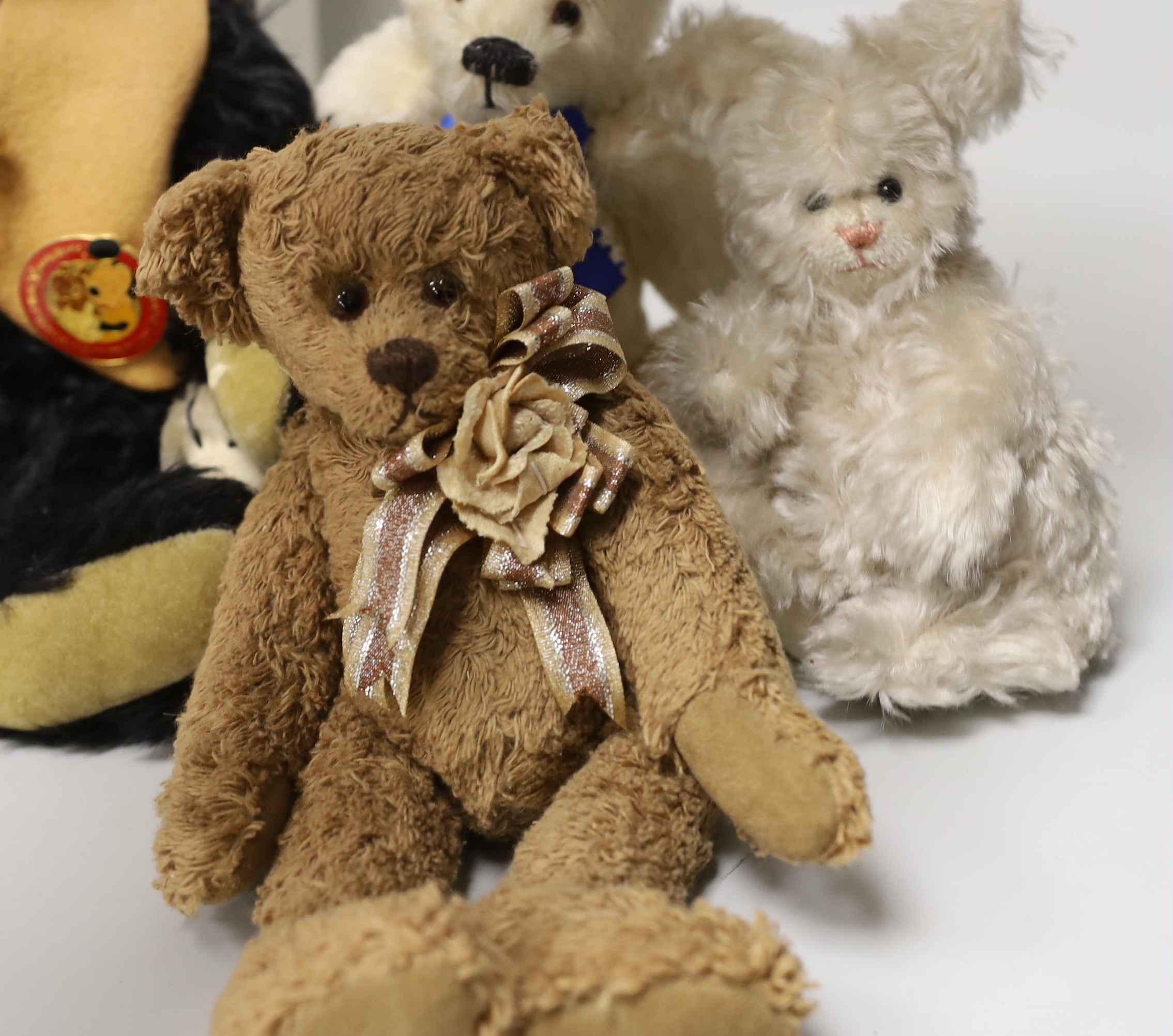 A Merrythought teddy and golly, boxed, with five artist's bears